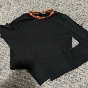 Black and orange long sleeve crop top